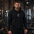Man in a 1 Moore Rep black sleeve print hoodie with 方 MR chest logo and 1 Moore Rep sleeve text in a gym